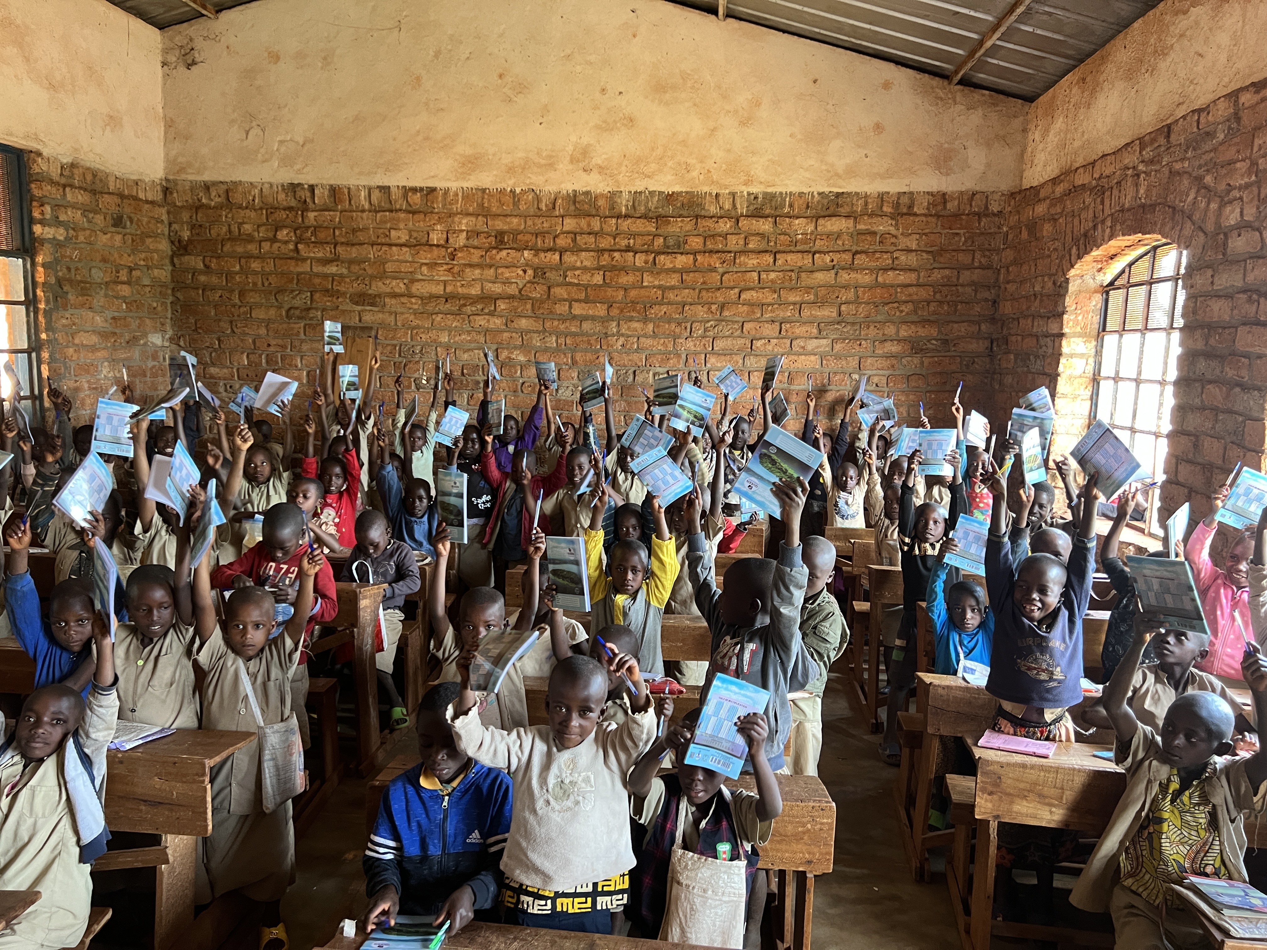Kids in Kibuye receiving school supplies